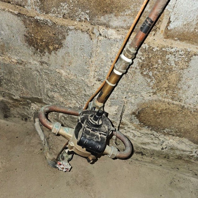 close-up of a lead service line in a home basement